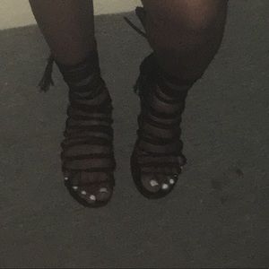 Black lace up sandals.